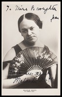 view Malcolm Scott in character as a "Gibson Girl". Photographic postcard, 1908.