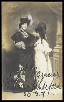 view Fred Sinclair in drag and Gracie Whiteford pose in character. Photographic postcard, 1907.