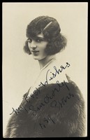 view Reg Stone, in drag, wearing a fur coat. Process print, 1927.