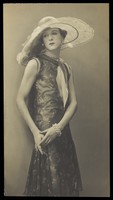 view Cecil Beaton, in drag; dressed in a patterned dress. Photograph, ca. 1925.