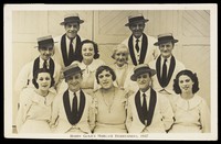 view Members of "Harry Gold's Margate Entertainers", one in drag, pose for a group portrait. Photographic postcard, 1937.