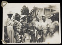 view Men in drag pose outside dressed in summer attire. Photograph, 194-.