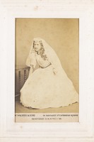 view A man in drag dressed as a bride.