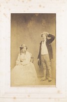 view Two men, one in drag, posing with comic expressions. Photograph, 189-.