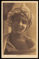 view Photograph of an Arab boy smiling towards the viewer, Egypt.