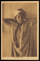 view Photograph of an Arab boy wearing a striped garment, Tunis.