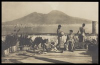 view Five naked youths relaxing on a terrace on the bay of Naples. Photographic postcard by W. von Gloeden, 19--.