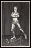 view Red McCarthy, the Olympic ice skater and later stunt skater, posing as a silver ice-skating statue. Photographic postcard, 1936.