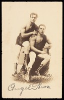 view The two Angel Brothers, acrobats posing in leopard-skin leotards. Photographic postcard, ca. 192-.