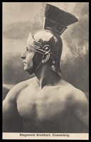 view Siegmund Breitbart, a strongman, wearing a Roman helmet. Process print, 192-.