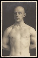 view An athletic man posing bare-chested. Photographic postcard, 19--.