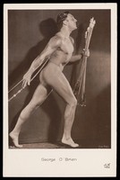 view George O'Brien posing holding a bow and arrows. Photographic postcard, 192-.