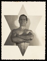 view A wrestler inset centrally in a six-pointed star. Photographic postcard, 19--.