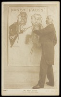 view George Rossi Ashton drawing a man and a woman with pansies as faces. Photographic postcard, 190-.