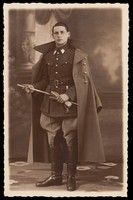 view A young Belgian cavalry officer holding a baton and gloves. Photographic postcard, 193-.