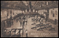 view Soldiers performing gymnastic exercises at a military gymnasium in Aldershot. Process print, 190-.