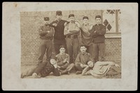 view Belgian soldiers posing for a group portrait in a casual manner. Photographic postcard, 1908.