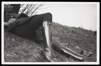 view The boots and gaiters of an army officer lying on some grass. Photograph, 193-.