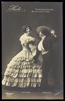 view Oscar Sabo dressed as a woman with Josefine Dora dressed as a man, as flamenco dancers. Photographic postcard by L. Willinger, 192-.