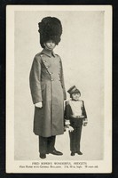 view Fred Roper's wonderful midgets : Fred Roper with General Rollason: 2 ft. 10 in. high. 18 years old.