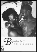 view Two black men embrace in bed; advertising the use of condoms to prevent the spread of AIDS. Lithograph.