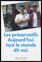 view Four men stand before a metal shuttered door bearing graffiti with the message in French: "Condoms. Today, everyone says yes"; a safe sex advertisement for by the Agence française de lutte contre le SIDA. Colour lithograph.