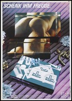 view The image of the rear view of a naked man lying on top of another spread across two gift-wrapped boxes with another box bearing the logo of The Hot Rubber Company; a safe sex advertisement. Colour lithograph.