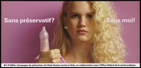 view A blond-haired woman holds up a thumb wearing a blown up condom with the statement 'Without a condom? Without me!'; French version of a series of 'Stop SIDA' [Stop AIDS] campaign posters by the l'Aide Suisse contre le SIDA, in collaboration with the Federal Office of Public Health. Colour lithograph.