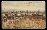 view Postcard photograph of "RAMC picking up wounded in a captured village" on the Western Front during the First World War