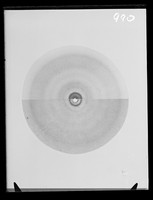 view Comparative image of an x-ray diffraction exposure of a phage sample and a DNA sample. Referenced as "Phage and DNA"