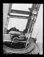 view Photograph of scientific apparatus referenced as "Vacuum ultra-violet monochromator prism drive mechanism"