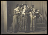 view Cecil Beaton in theatrical drag, with others. Photograph by Hill & Saunders , ca. 1925.