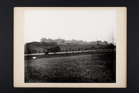 view General view of buildings taken from fields south of railway line