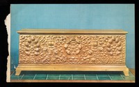 view Front of a gilt stucco chest with pomegranate motif. Tuscany. XVth century.