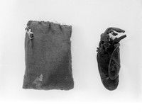 view M0000013: Two pouches containing an amulet and a charm