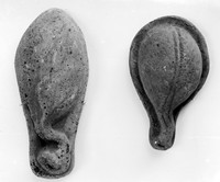 view M0000026: two pear shaped, stone cast votive offerings