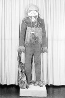 view M0000701: African traditional healer's string knitted suit and mask