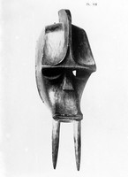 view M0001020: Carved wooden mask with two long prongs