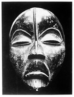 view M0001027: Carved wooden mask with a ridge down the forehead and nose