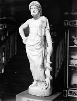 view M0001576: Photograph of a small stone statue of Aesculapius holding the Rod of Asclepius