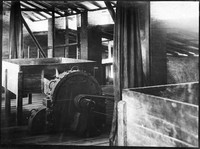view M0001623: Photograph of the view in the grinding house, showing platform and one disintegrator with feeding bin, illustrating the cultivation of cinchona and the production of quinine