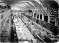 view M0001560: Photograph of the interior of quinine factory in Amsterdam, with factory workers in the background