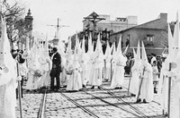 view M0001817: Photograph of a procession of Catholic brotherhoods (cofradía) during the annual annual tribute of the Passion of Jesus Christ called Holy Week (Semana Santa) in Seville, Andalucia during Easter