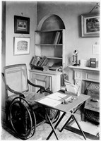 view M0001857: Photograph of Edward Morell Holmes' wheelchair and desk where he worked until his death