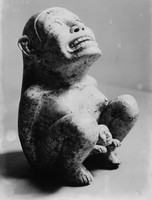 view M0003316: Side view of a statuette of Tlazolteotl, an Aztec goddess of fertility