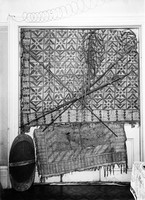 view M0003679: Photograph of mats, spears, shield and a fishing net