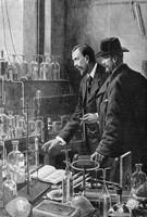 view M0004621: William Ramsay (1852-1916) and Pierre Curie (1859-1906) in laboratory