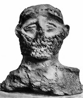 view M0004969: Terracotta votive offering: a man's face coverd in sores