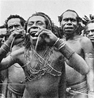 view M0005321: Man swallowing a cane as part of a ritual, New Guinea.