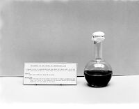 view M0007562: Glass containing blood and water for Lister display